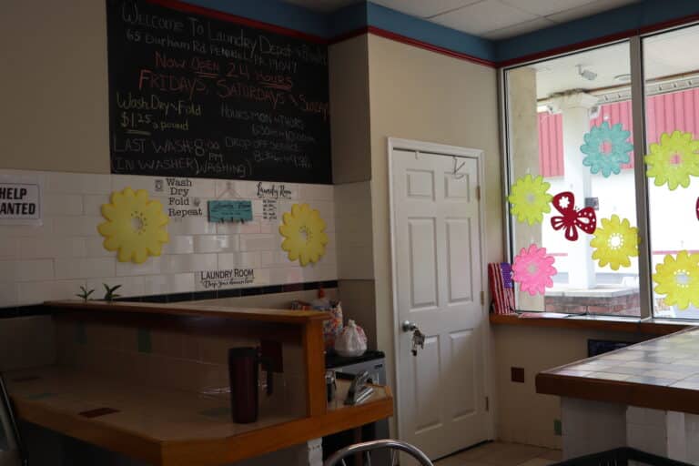 a room with a blackboard and a white door